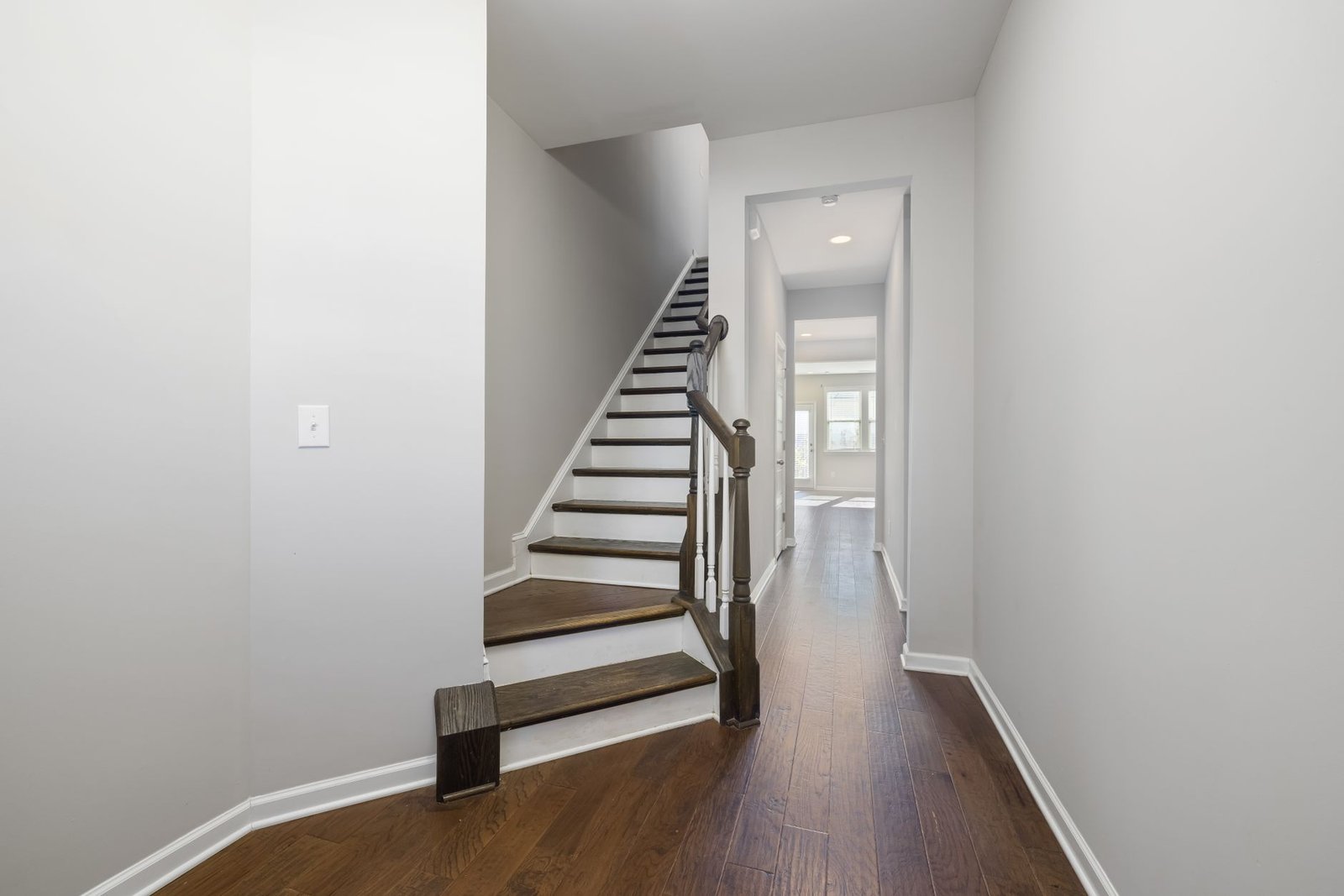 Hallway with a staircase and open internal doors, the best place to put a dehumidifier in most houses