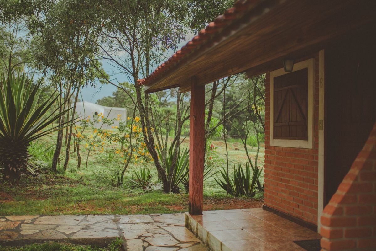 Single-storey brick house with a clay tiled roof and a covered paved entrance
